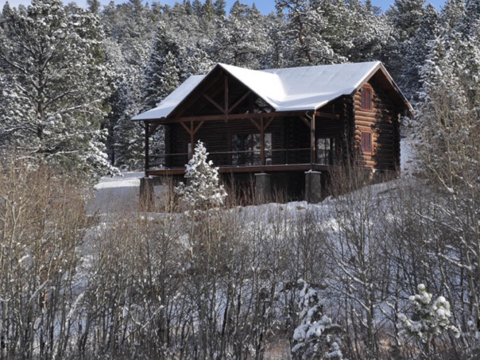 Timber Frame Log Cabin Exterior in Snow