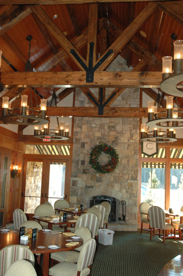 Timber Frame Home Living Room with King Post Truss with Struts and black steel connectors