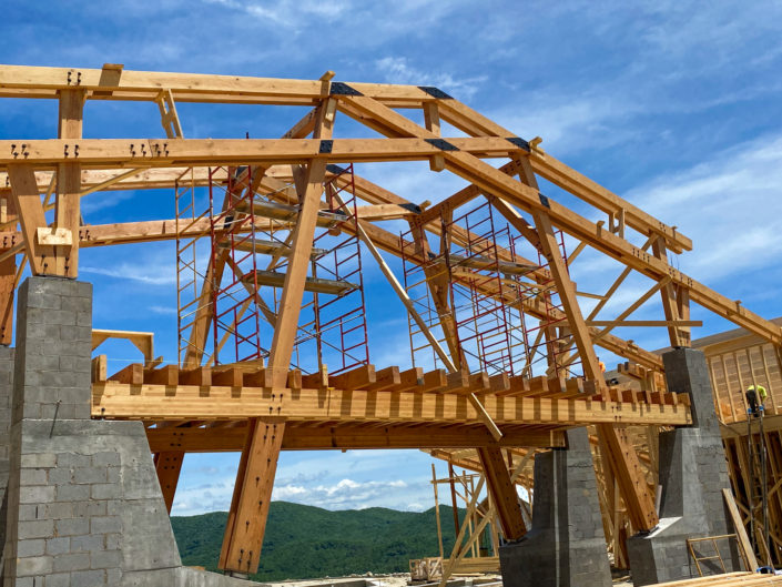 Timber Frame covered bridge outdoor entertainment dining area feature at The Summit Clubhouse is well underway.